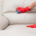 cleaning a white leather sofa